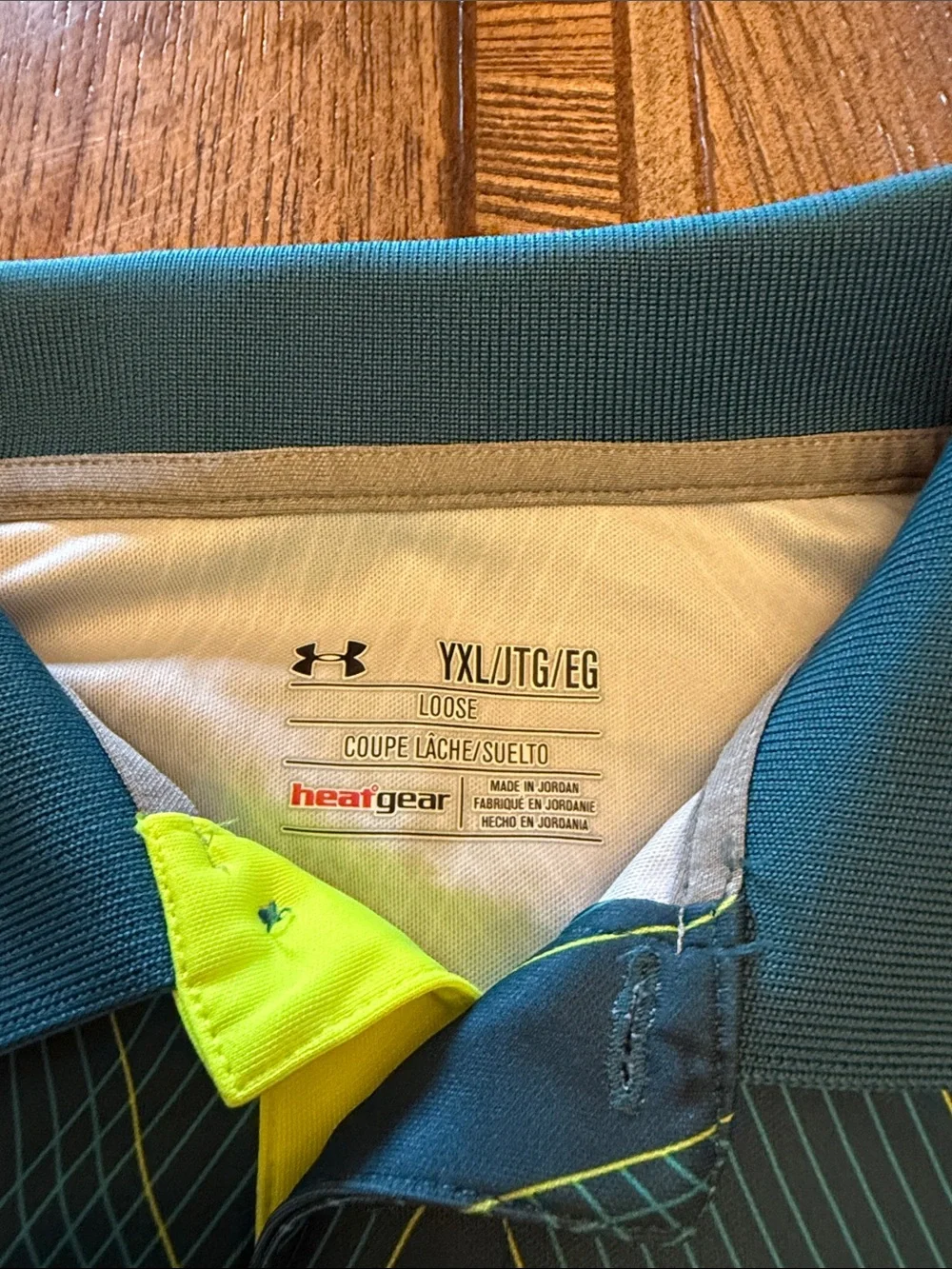 Under Armour Boys Black Polo with Yellow Logo and Teal Geometric Lines